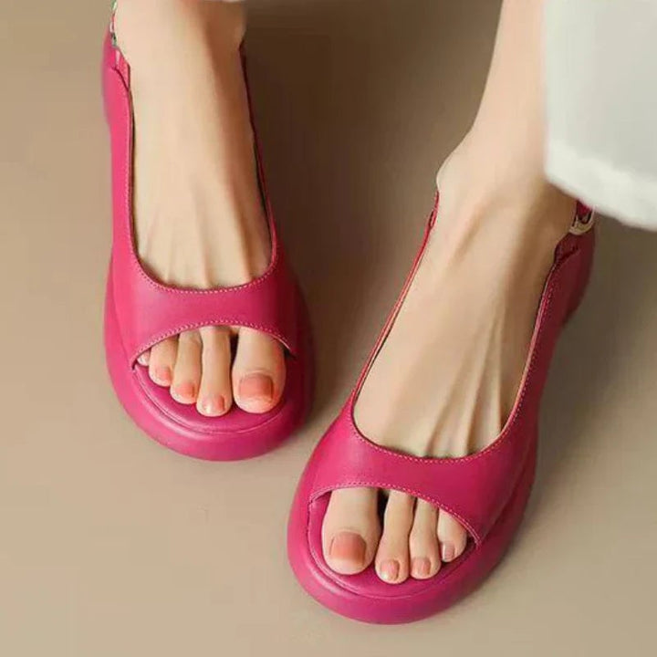 Close-up of Wren platform sandal sole and heel in Apricot showing cushioned footbed