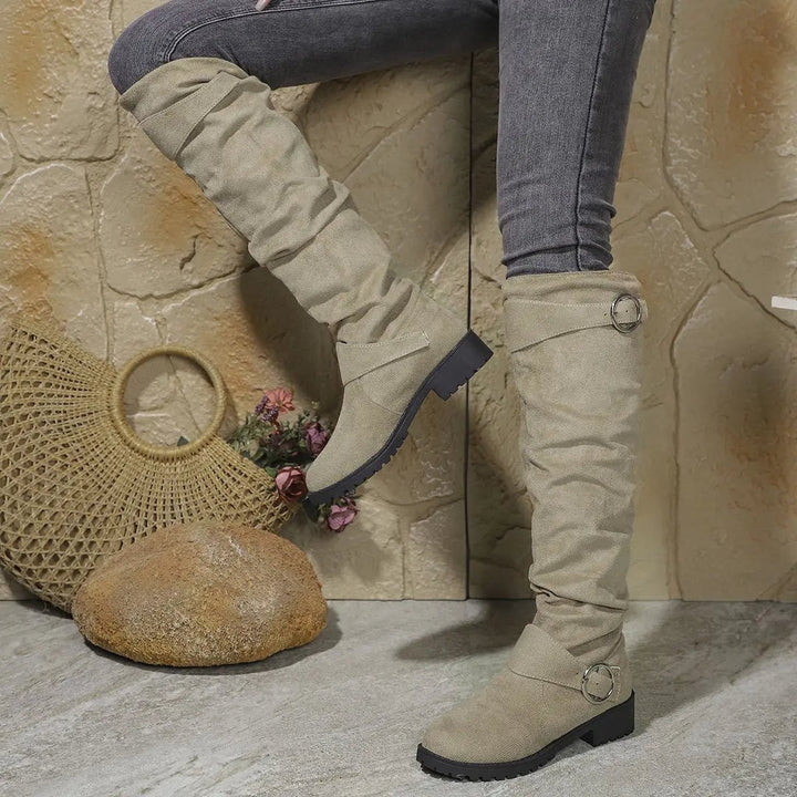 Wyn knee high boots styled with skinny jeans for a polished everyday look