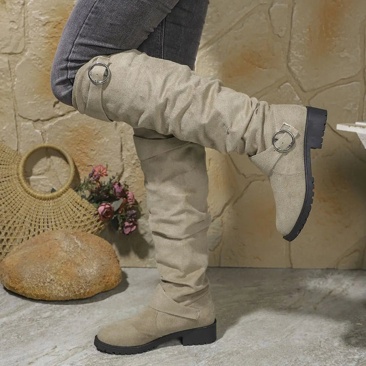 Back view of Wyn knee high boots highlighting the tall boot shaft and heel construction