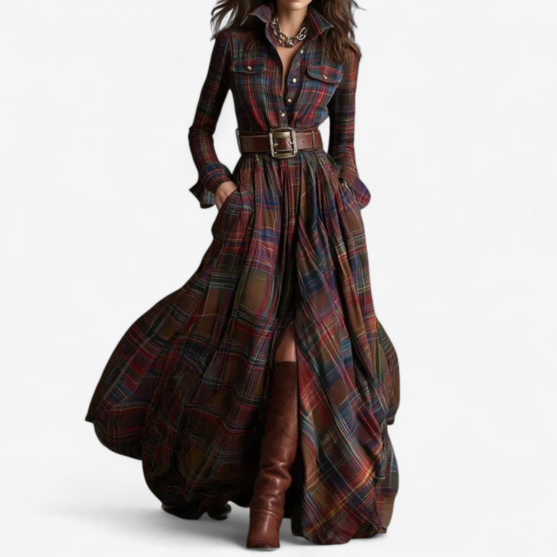 Model wearing the Xandra timeless maxi dress in reddish brown, featuring a flowing silhouette and elegant draping fabric