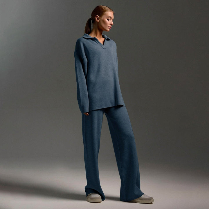 Model wearing the knitted tracksuit set with boots and accessories for an elevated casual outfit