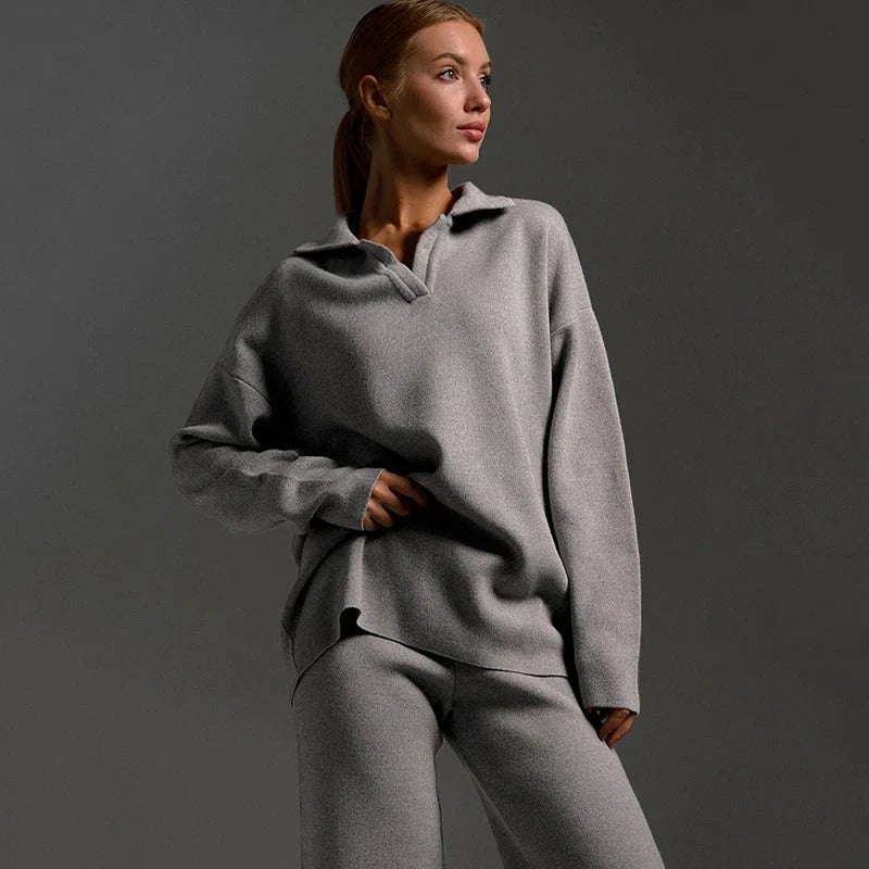 Flat lay of the knitted two-piece tracksuit set showing the pullover top and wide-leg pants together
