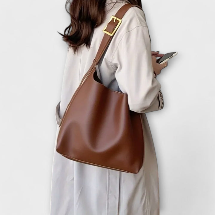 Yrla classic shoulder bag in black with clean silhouette detail