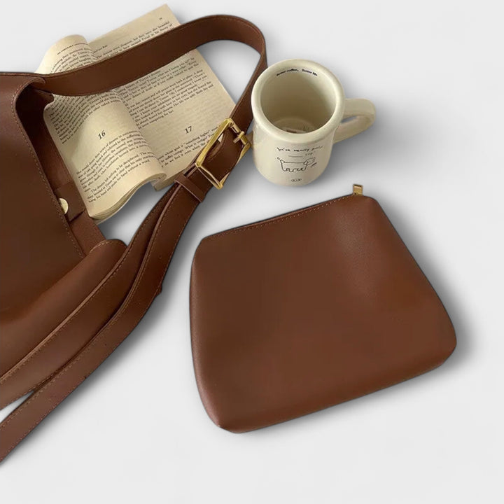 Close-up of Yrla shoulder bag hardware and strap adjustment in brown