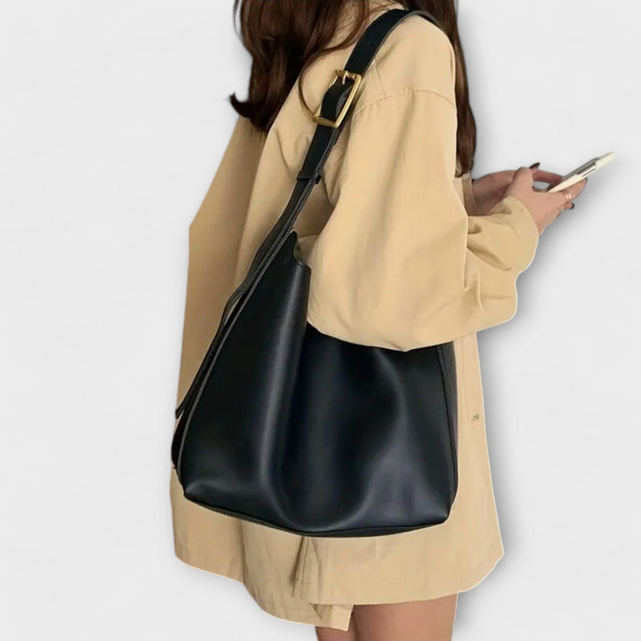 Yrla shoulder bag in black and brown color options side by side