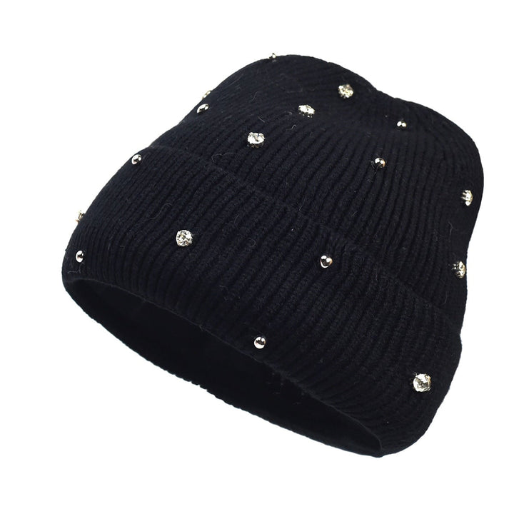Overhead flat lay of all five beanie color options: navy, beige, white, black, and pink