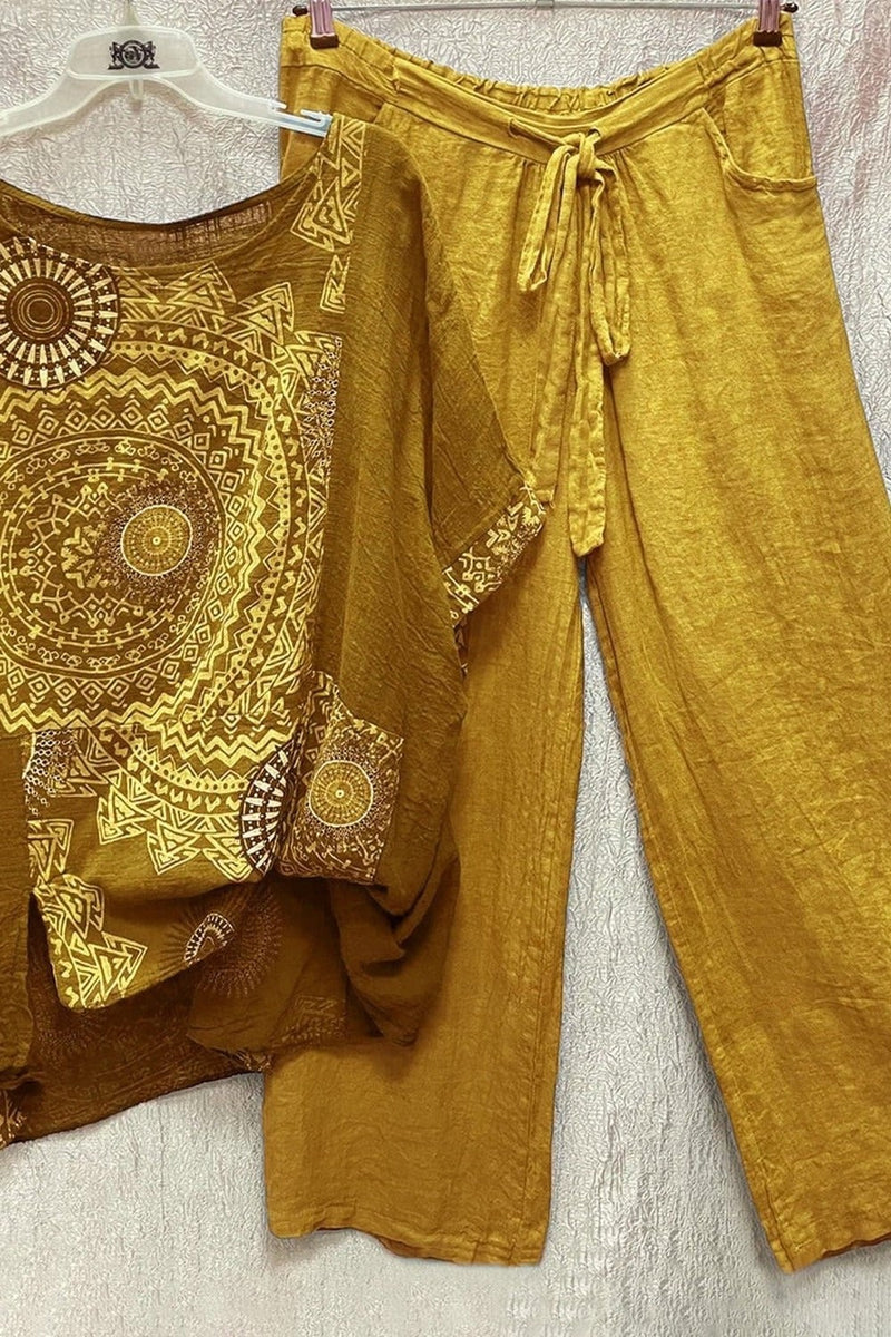 Woman wearing the Zahara yellow mandala print co-ord set with wide-leg drawstring pants and matching short-sleeve top