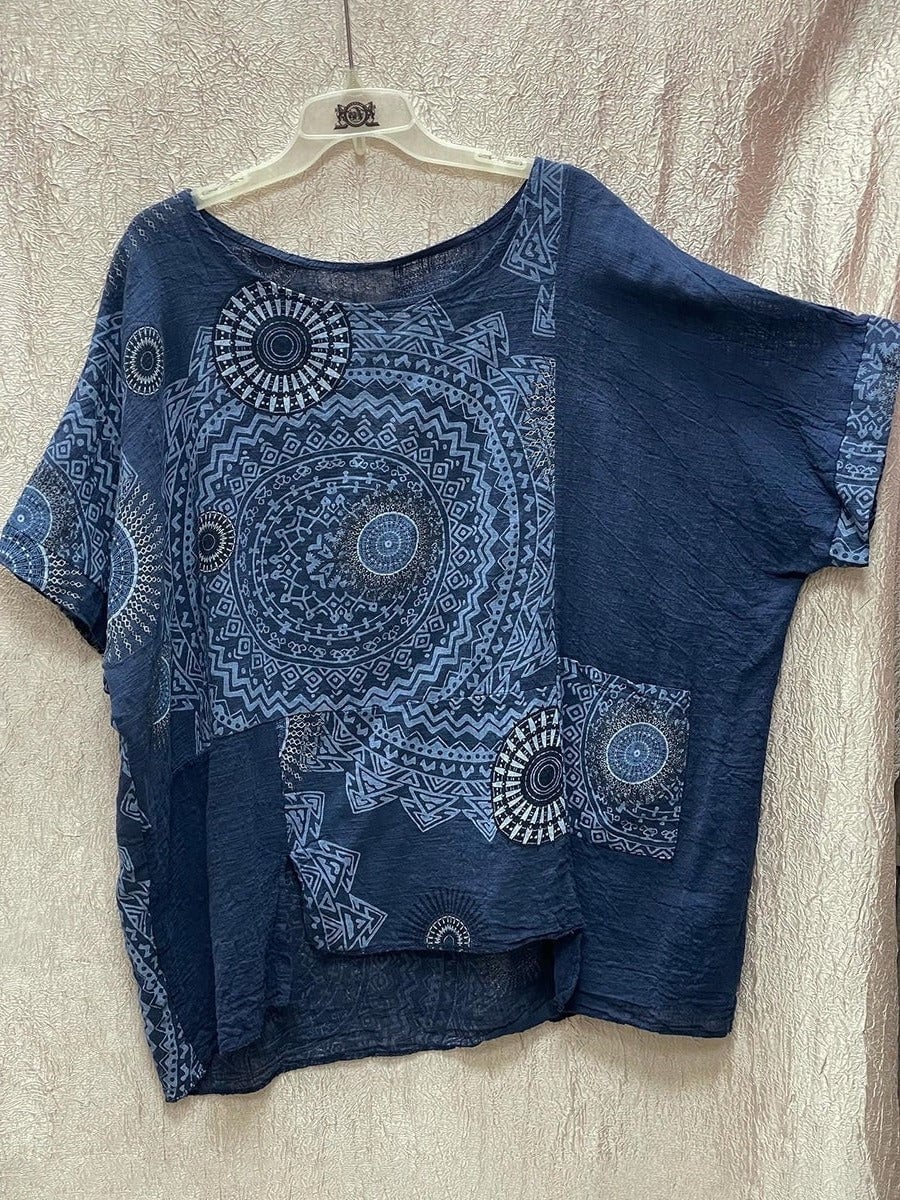 Close-up detail of the Zahara mandala print top showing the oversized circular boho print pattern