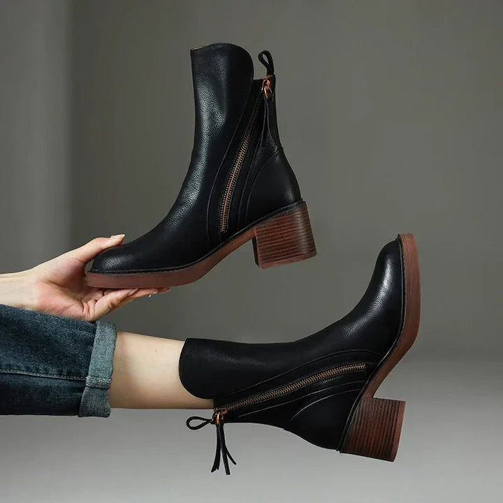 Zali stylish orthopedic ankle boots in black with cushioned insoles and contoured silhouette, front view