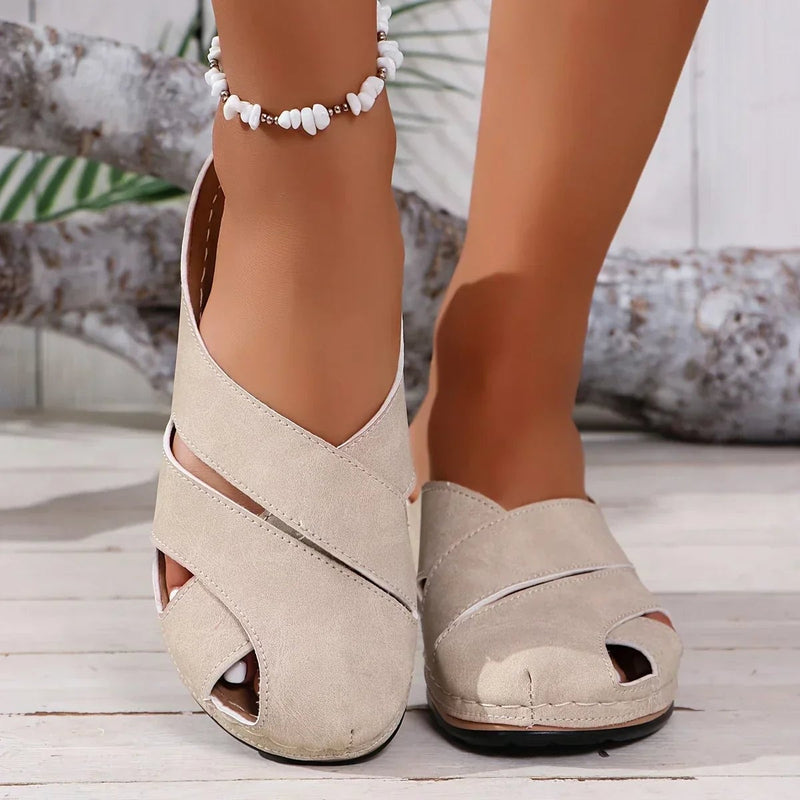 Women's platform wedge sandals in khaki displayed at an angle highlighting the platform height