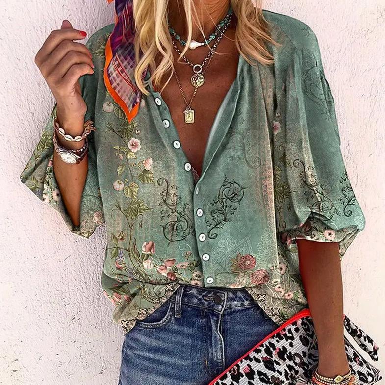 Woman wearing a green boho print V-neck long sleeve button-down blouse with relaxed fit