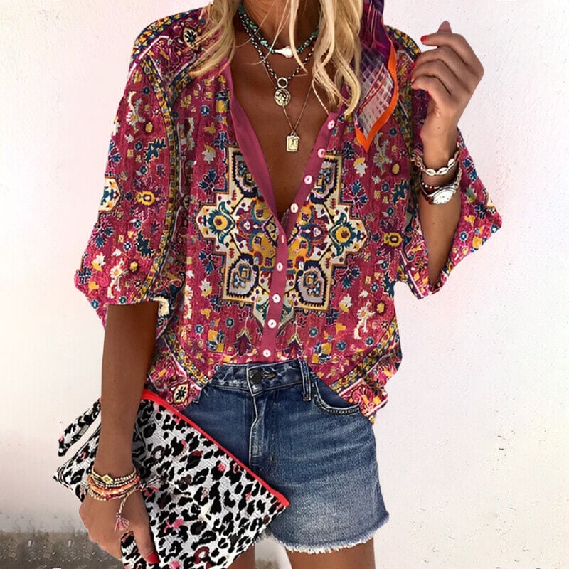Close-up of red boho print blouse V-neck and partial button placket detail