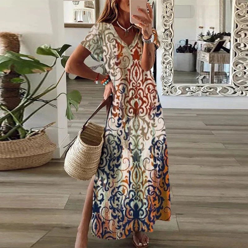 Woman wearing a brown ornamental damask boho maxi dress with V-neck, short sleeves, and side split