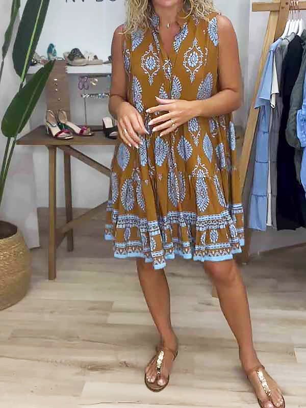 Front view of a boho tribal-print V-neck sleeveless tiered mini dress in caramel brown with contrast border hem