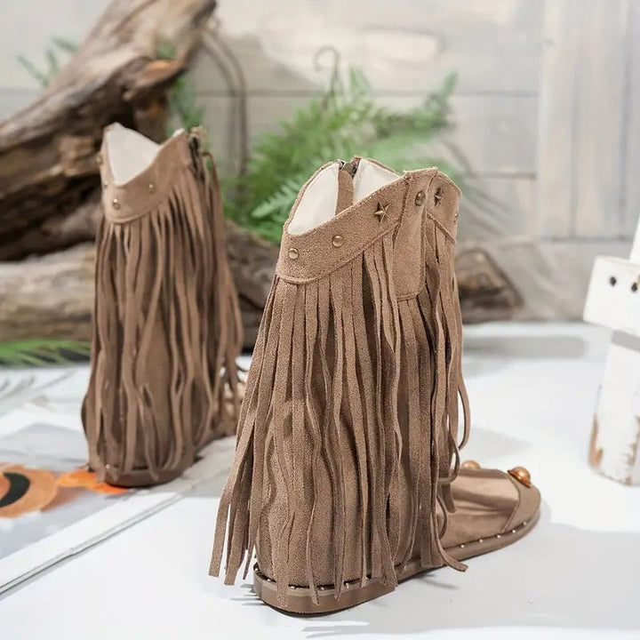 Khaki fringe ankle sandals showing flowing fringe detail and mid heel, side view