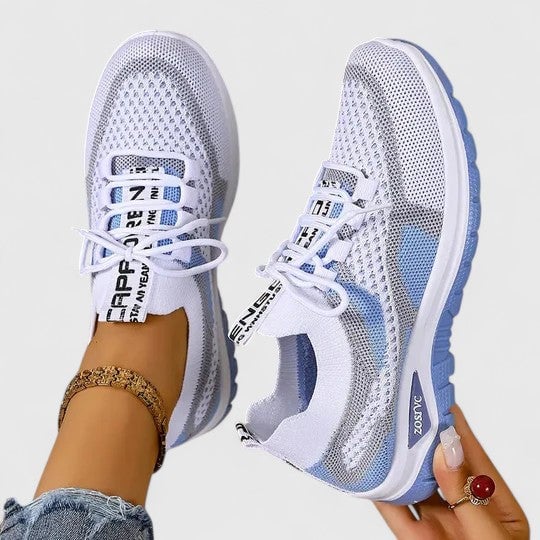 Women's lightweight mesh lace-up sneakers with graphic text lace detail and chunky sole in blue