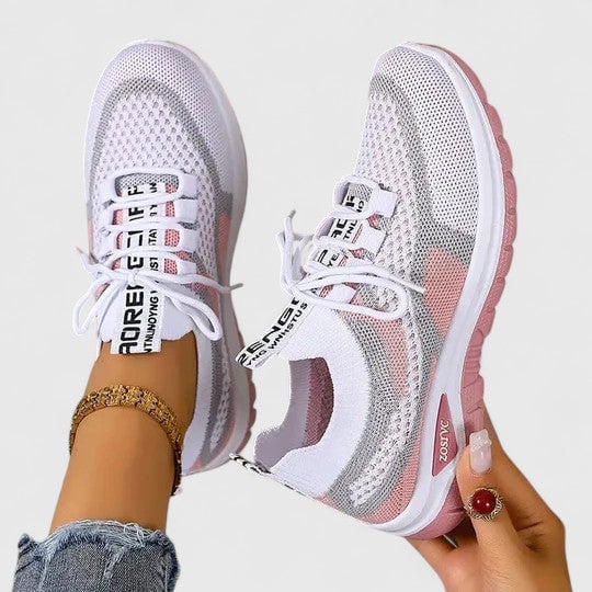 Front view of women's lace-up mesh sneakers with chunky cushioned outsole in pink