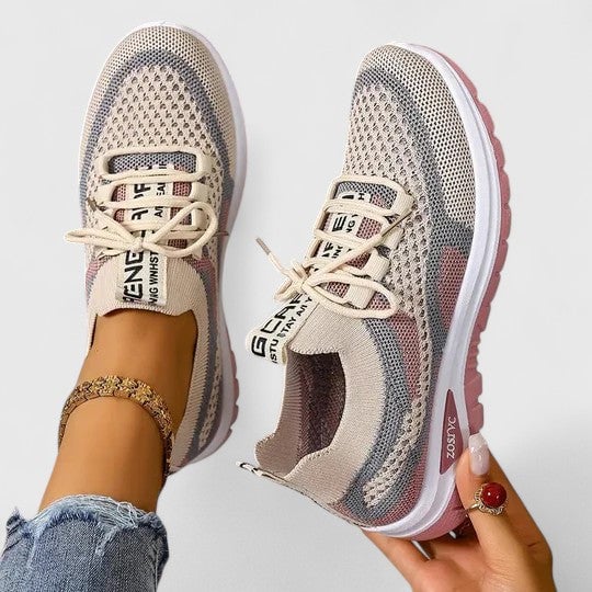 Women's mesh sneakers in khaki colorway showing open-weave upper and platform-inspired sole