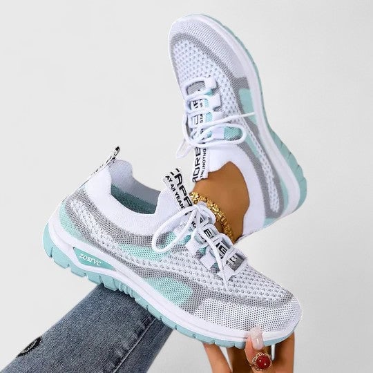 Women wearing mesh lace-up sneakers styled with casual athleisure outfit