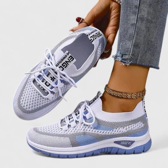 Heel and side profile of women's lightweight mesh sneakers showing ankle collar