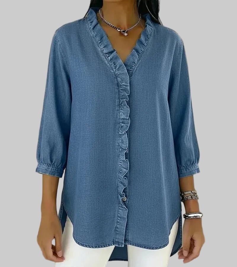 Woman wearing ruffle V-neck blouse in light blue with casual weekend outfit