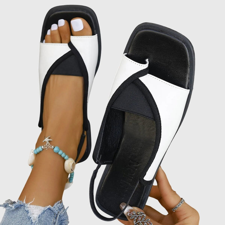 Women's square toe colorblock slip-on flat sandals in white colorblock with elasticated slingback strap, front view
