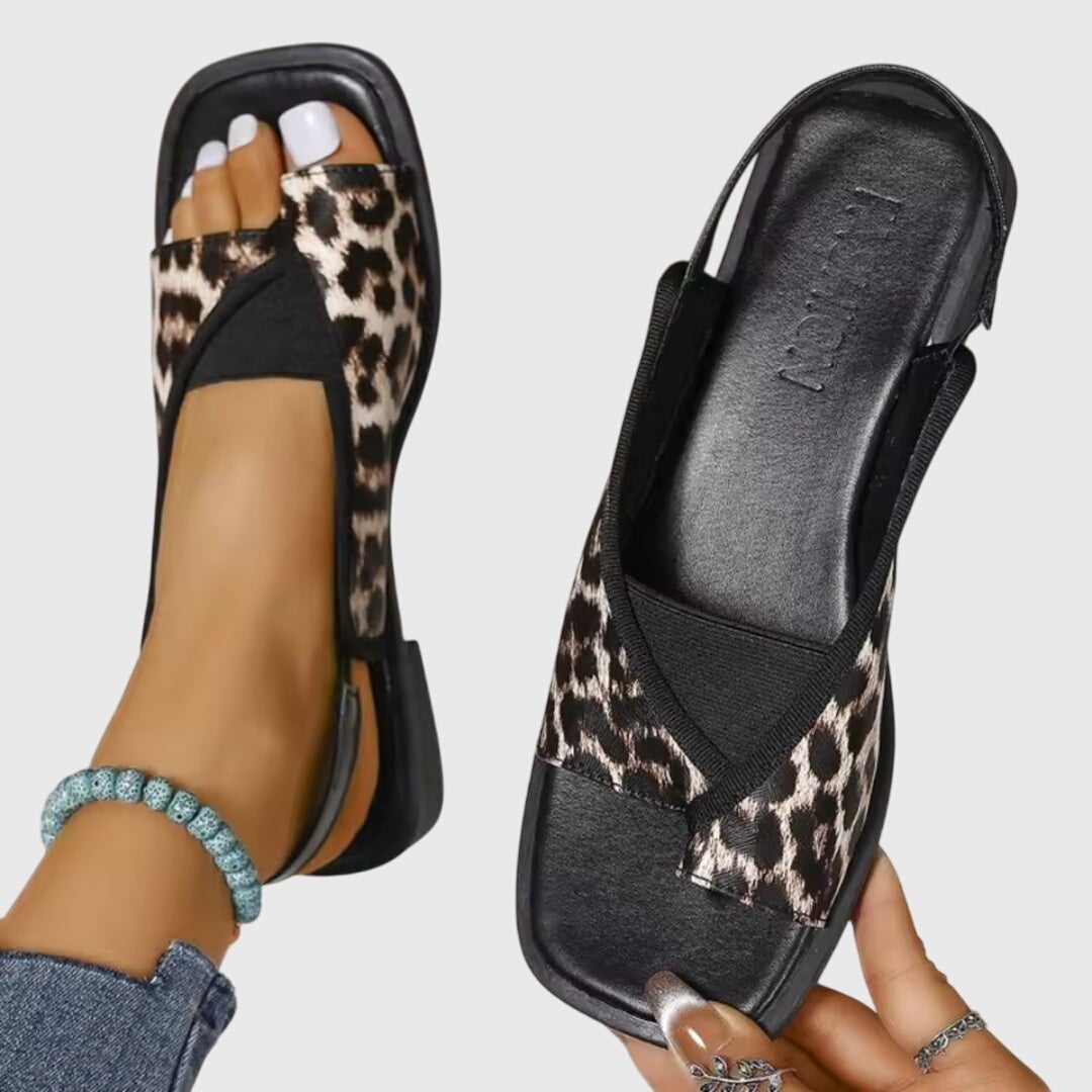 Leopard print square toe flat slip-on sandals with elasticated slingback strap, three-quarter angle view
