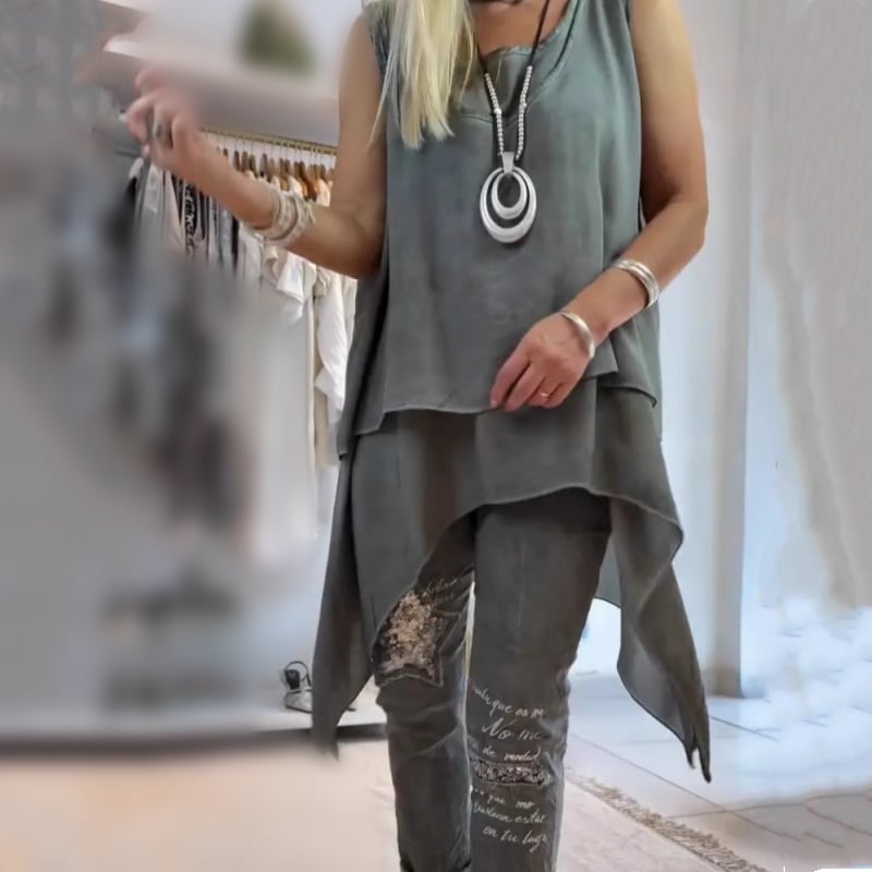 Close-up of the floral wide-leg pants from the two-piece set showing relaxed straight-cut silhouette