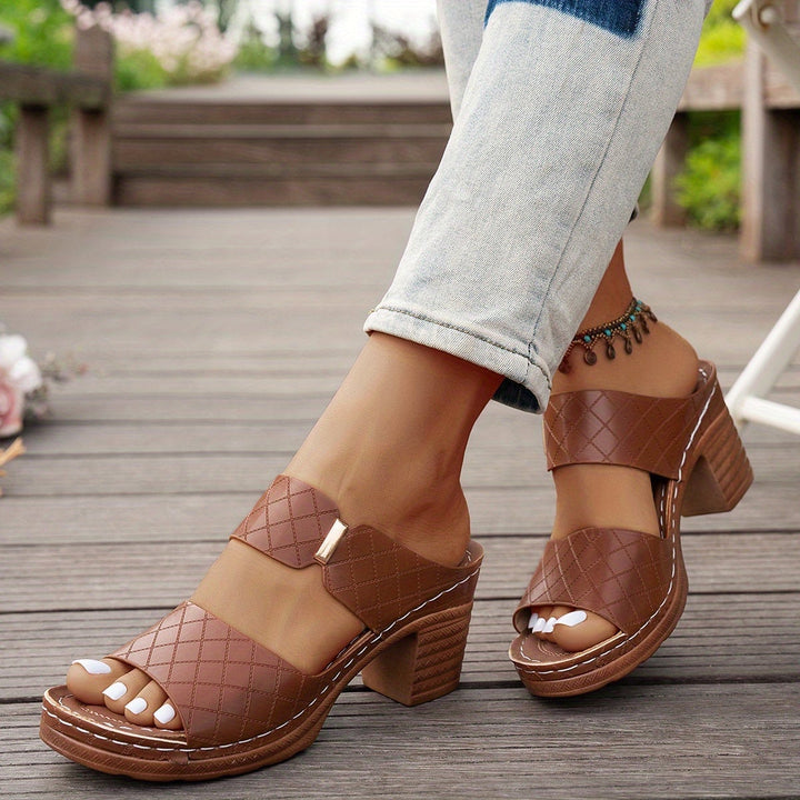 Zelda women's sandal in black, front three-quarter view