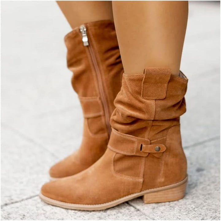 Side view of suede knee-high boot in dark green showing sleek leg-lengthening silhouette