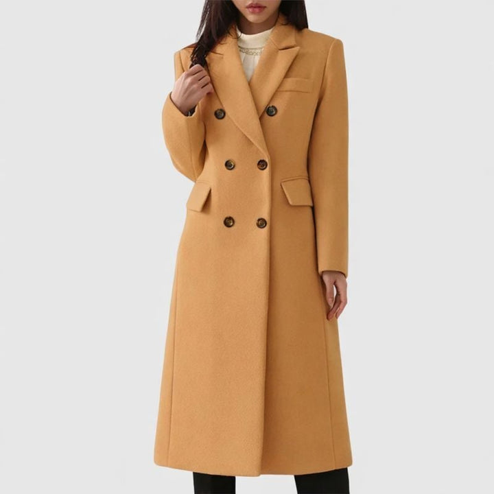 Woman wearing the Ziva cozy overcoat in brown, featuring a tailored silhouette and clean minimal design
