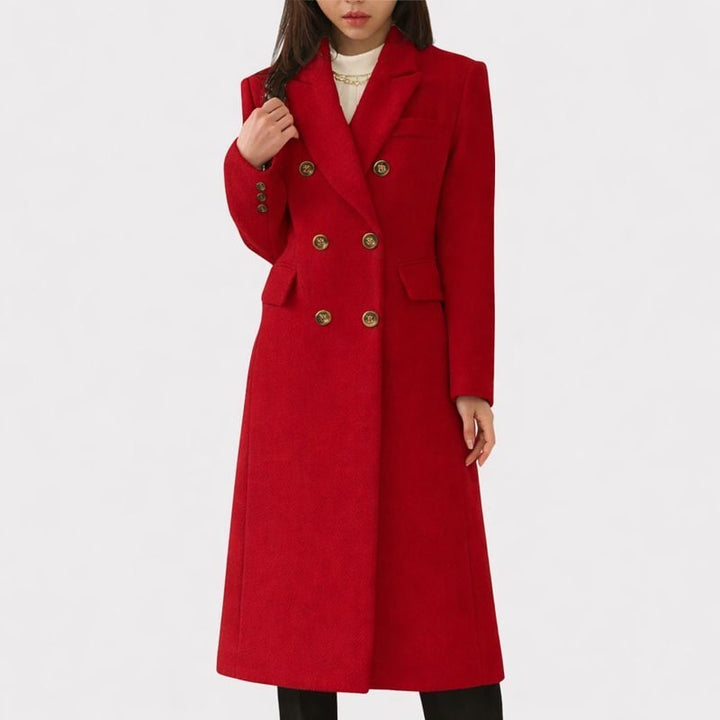 Side profile of the Ziva cozy overcoat in dark green highlighting the elegant tailored cut