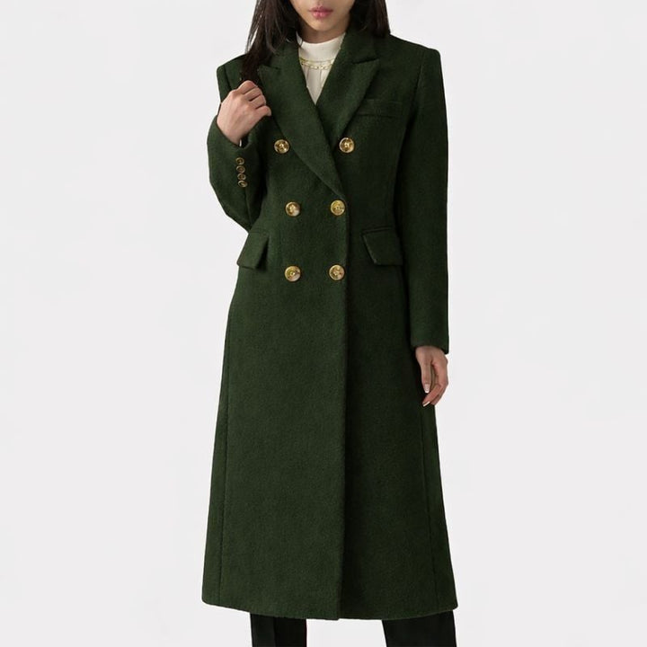 Woman wearing the Ziva overcoat in blue styled casually with jeans and sneakers
