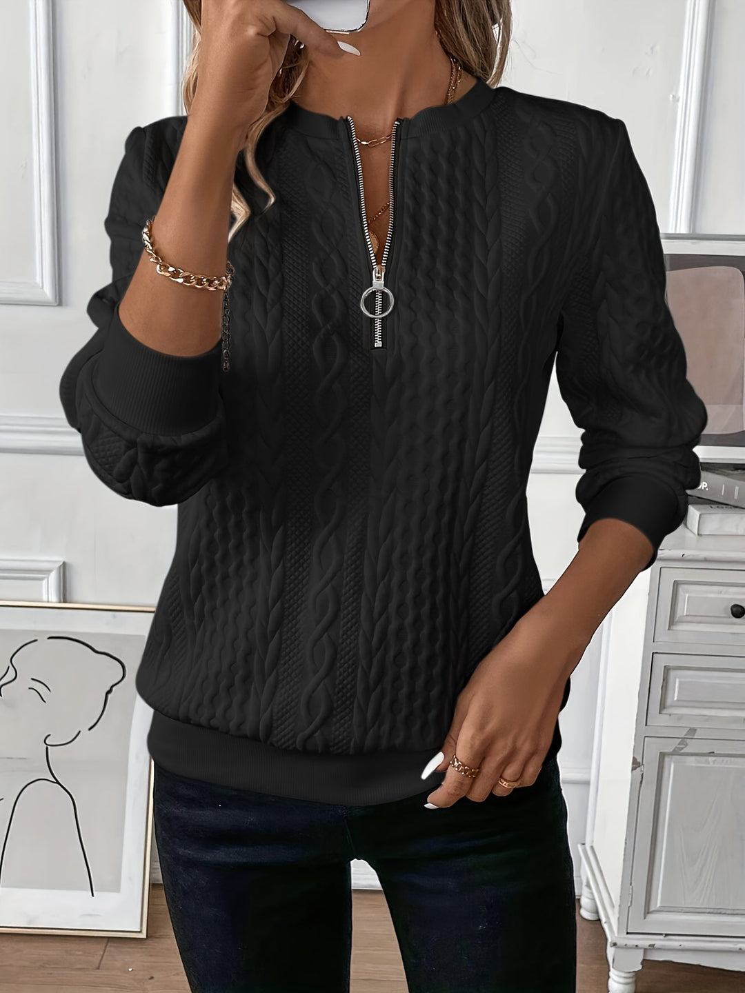 Purple zip-up cable knit sweater on a model, front zipper closure visible