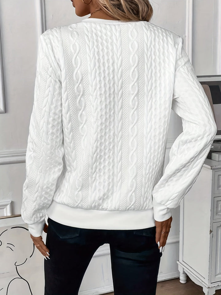 Grey zip-up cable knit sweater on a woman, versatile neutral colorway