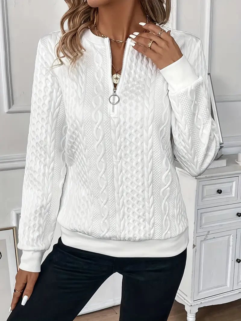 Side view of a woman wearing a cable knit zip-up sweater showing tailored slim fit