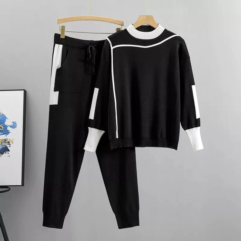 Front view of the Zoey luxury tracksuit in black showing the contemporary cut and polished silhouette