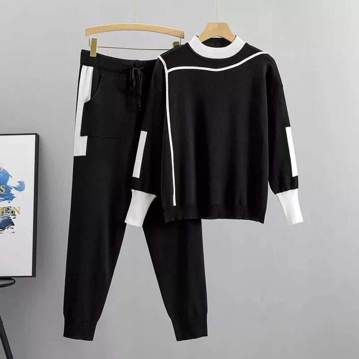 Front view of the Zoey luxury tracksuit in black showing the contemporary cut and polished silhouette