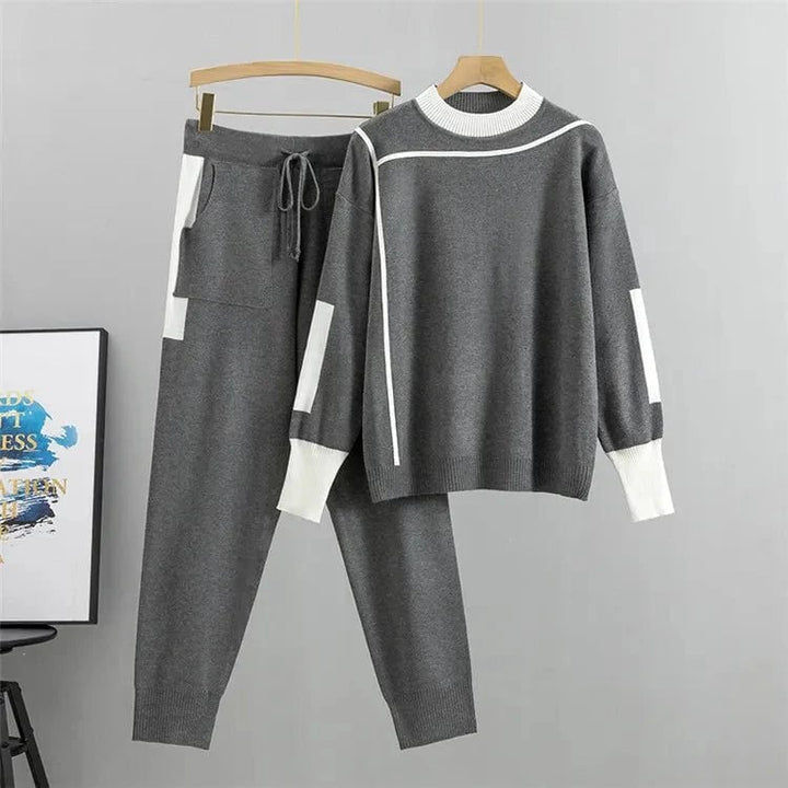 Side profile of the Zoey tracksuit set in grey highlighting the sleek jacket and matching pants