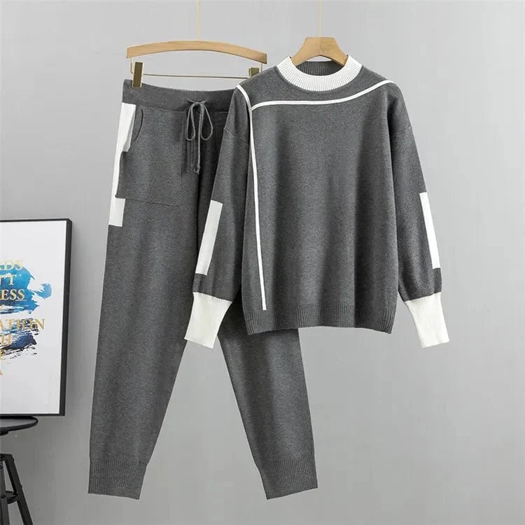 Side profile of the Zoey tracksuit set in grey highlighting the sleek jacket and matching pants