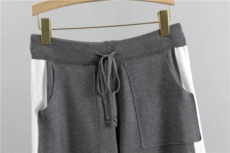 Full-length shot of the Zoey two-piece tracksuit in black showing pants length and overall silhouette