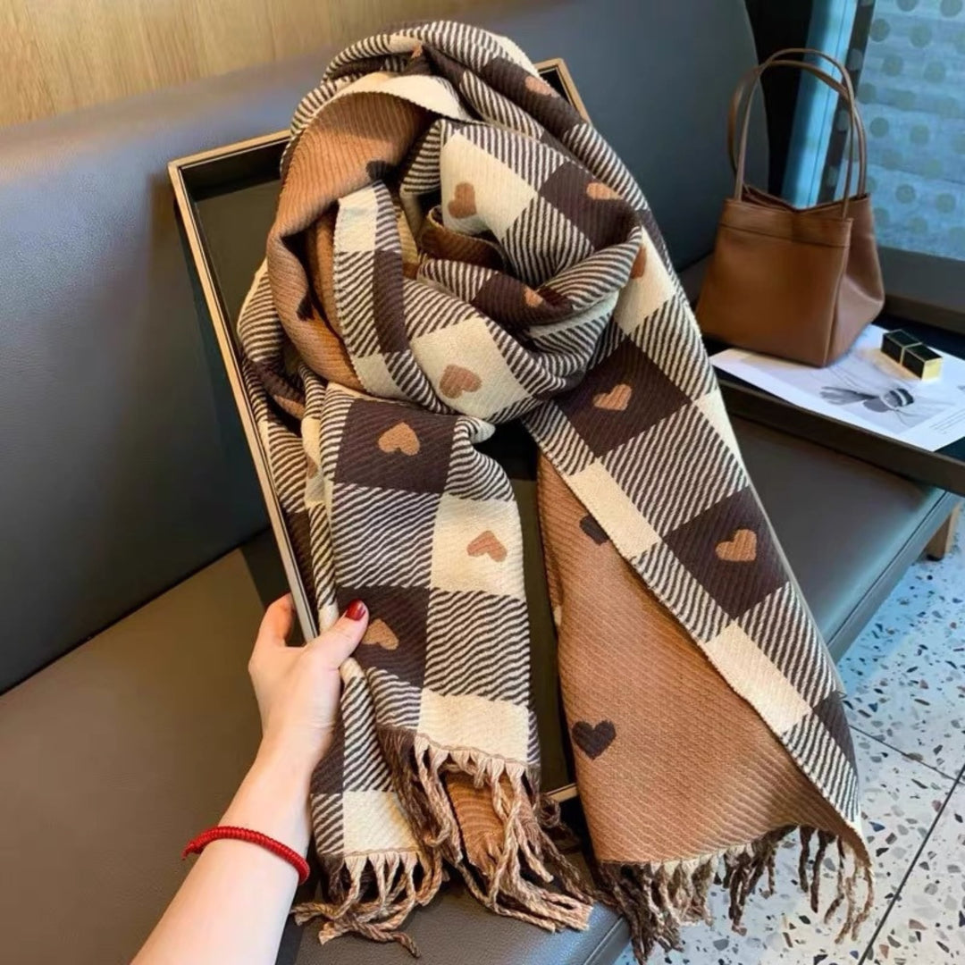 Overhead flat lay of plaid scarf in Mickey Black showing full length and tassel ends