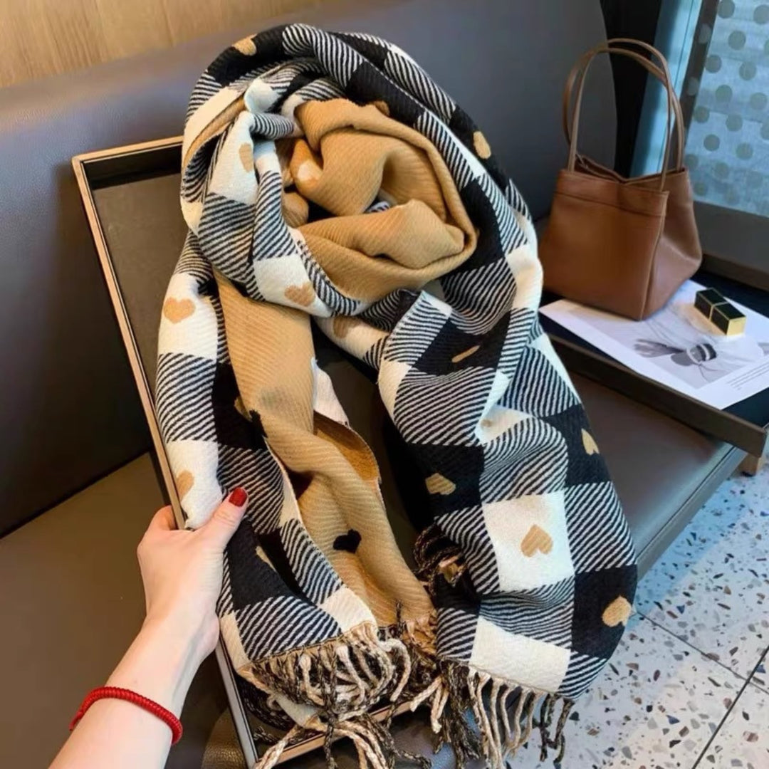 Woman in a cozy winter outfit wearing a Heart Khaki reversible plaid scarf outdoors