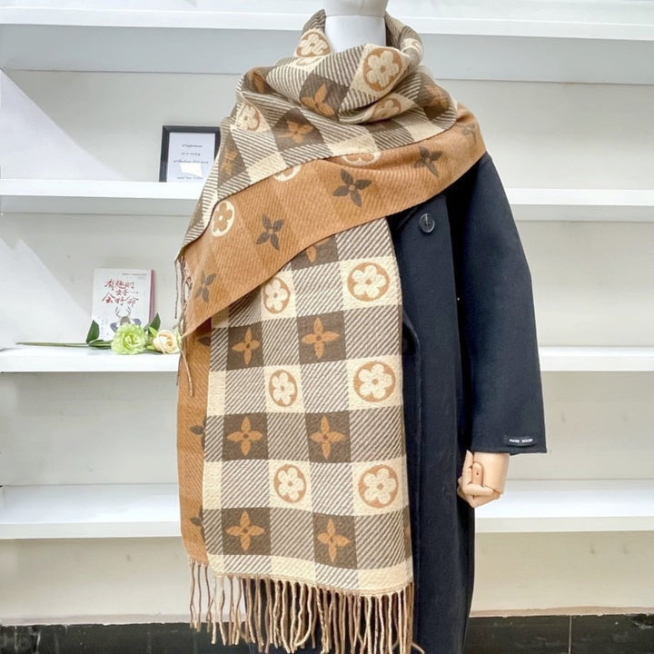 Close-up of scarf size S and L laid flat to show length difference