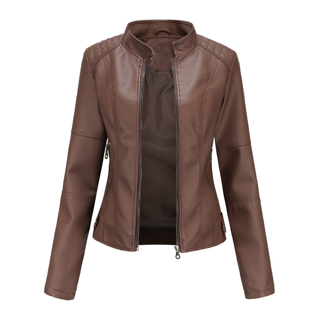 Detail shot of adjustable collar buttons on the Zyra structured jacket