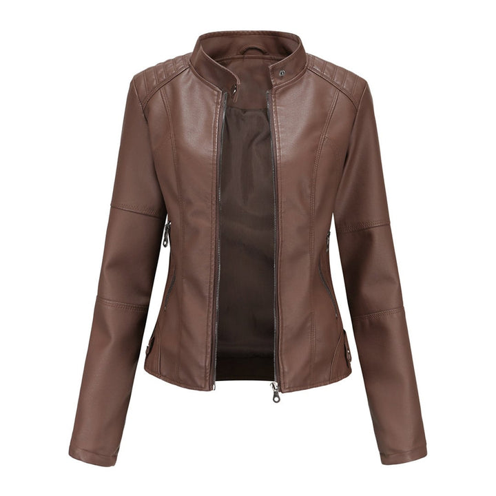 Detail shot of adjustable collar buttons on the Zyra structured jacket